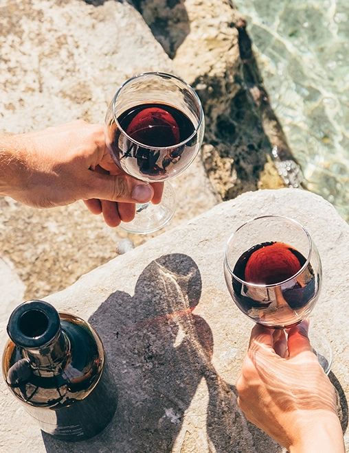 drinking wine over sand